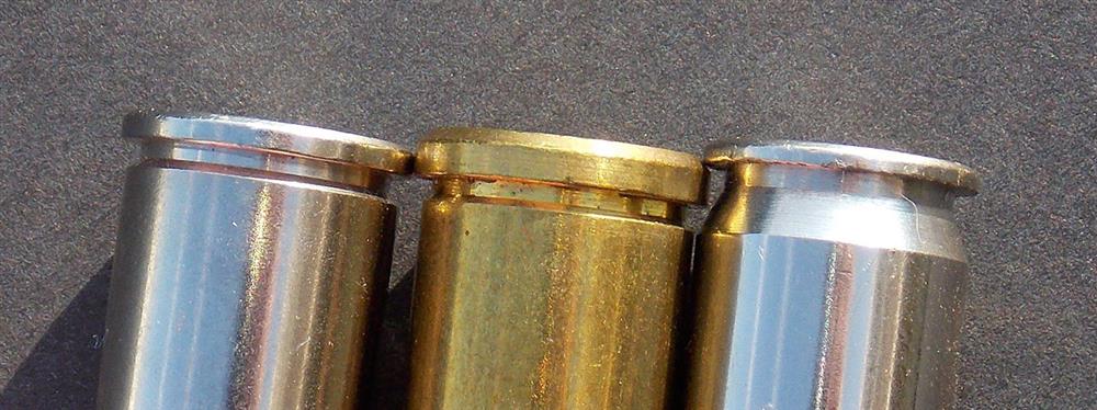 Closeup of three .45 caliber cartridges showing the differences in each