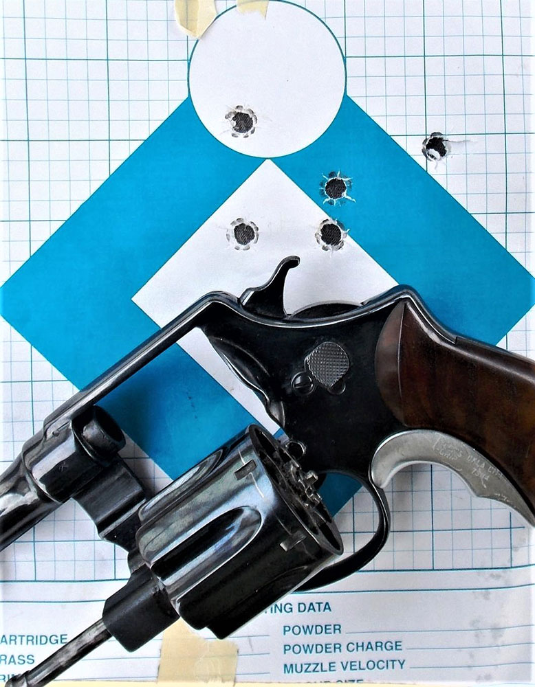 .45 ACP rexolver on a blue and white paper target