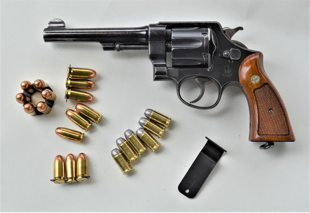 Smith and Wesson revolver chambered in .45 and shown with .45 ACP and .45 Auto Rim ammunition