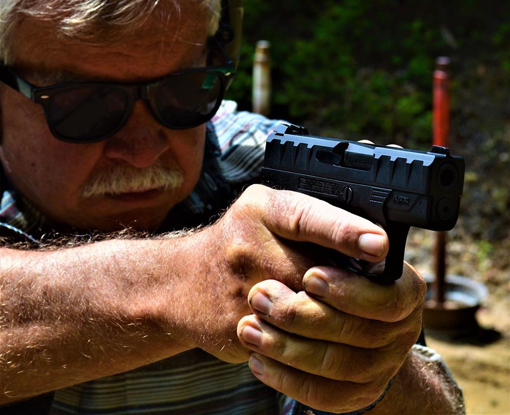 Bob Campbell shooting the Beretta APX Carry pistol while wearing safety glasses