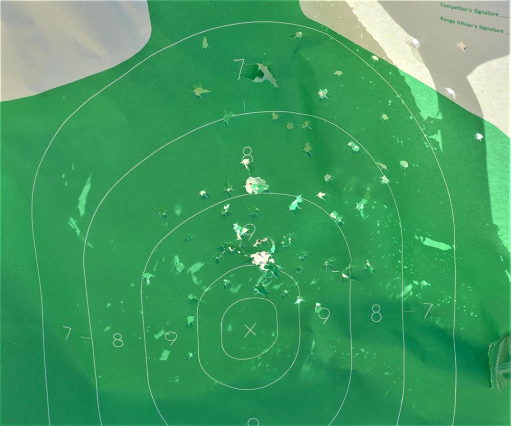 green silhouette target after being hit with buckshot