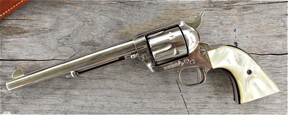 Colt Single Action Army left profile on a wood background