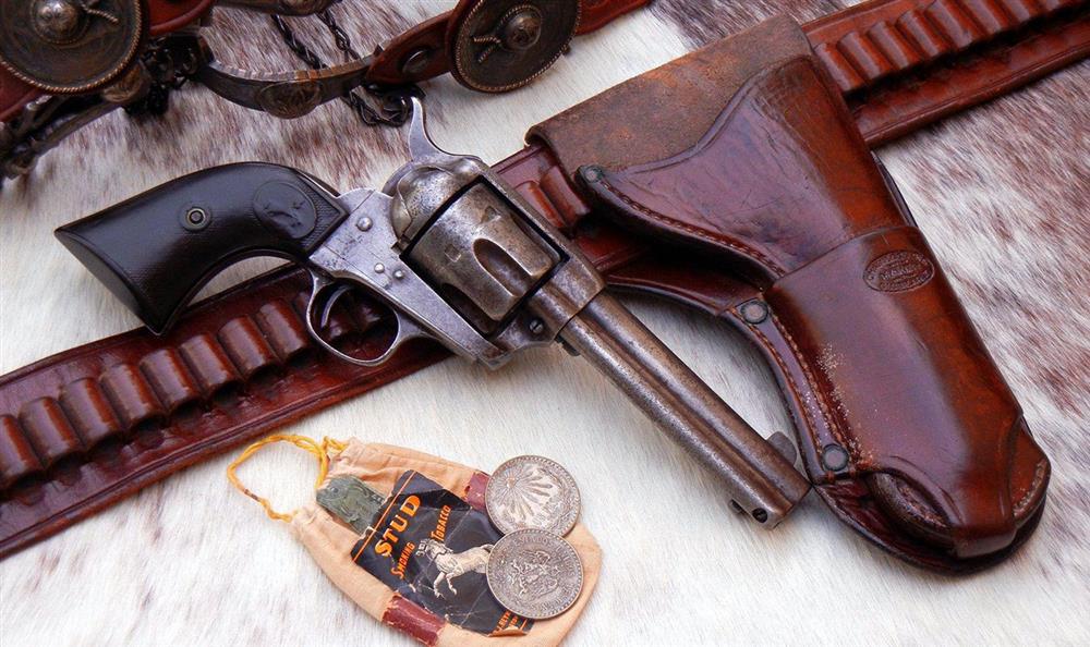 Old Colt Single Action Army revolver with original Collins holster