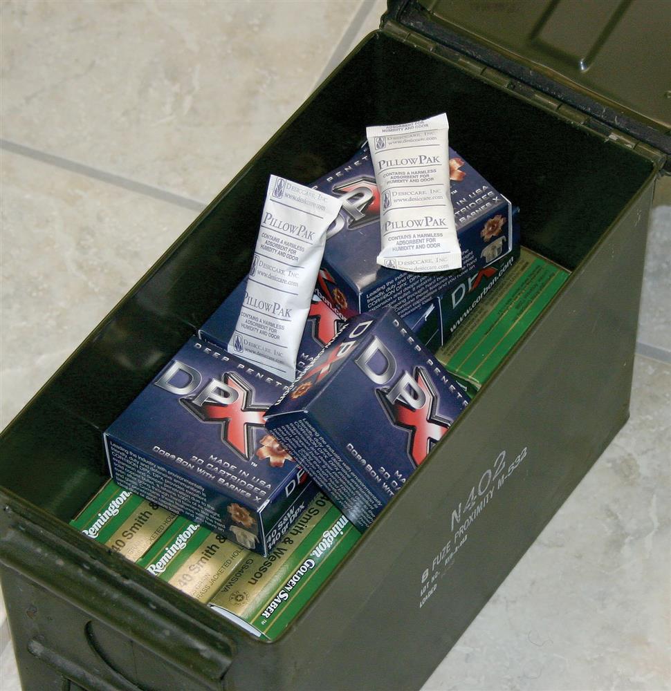 Ammo can packed with boxes of handgun ammunition and descant packs