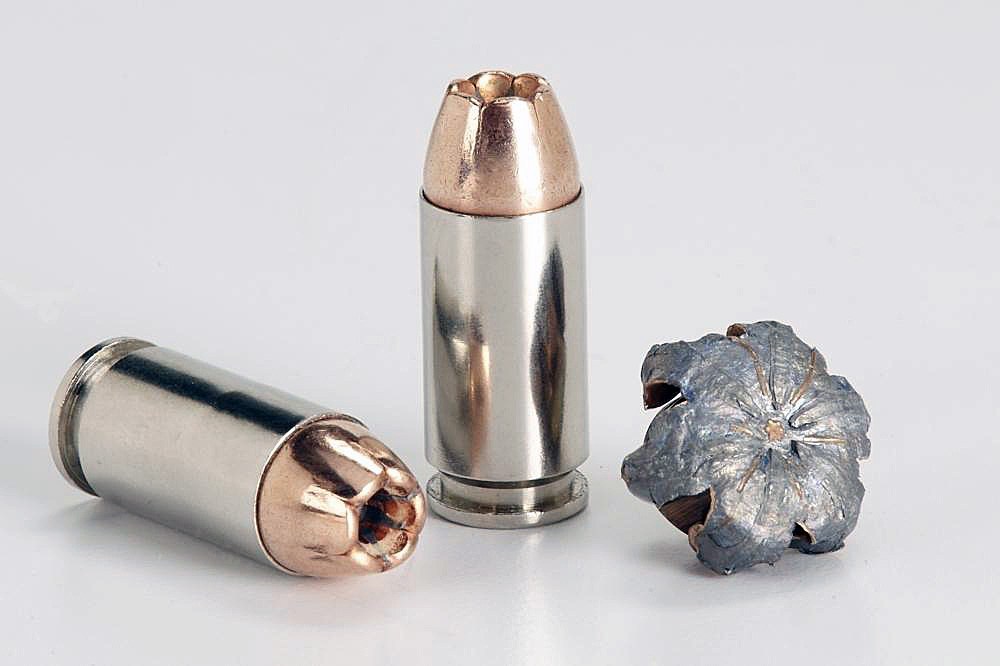 Two Winchester 9mm Cartridges and one upset PDX personal defense bullet