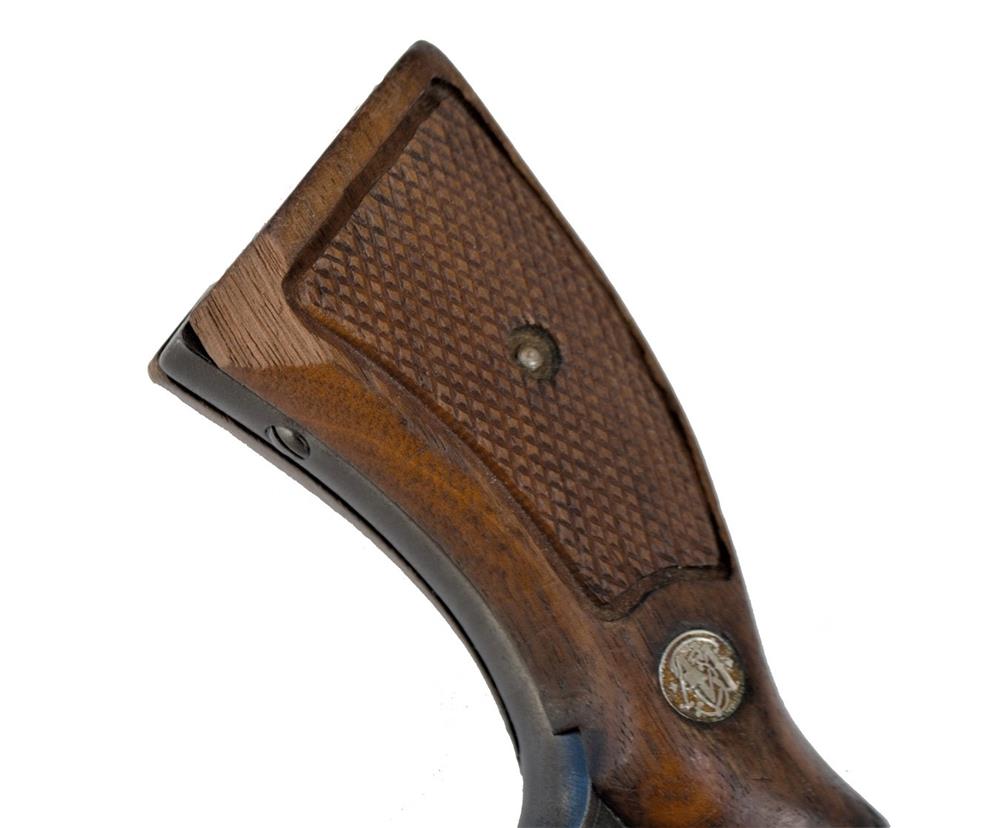 revolver pistol grip with a chip in the wood