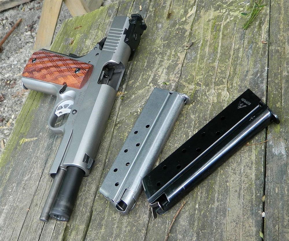 Ruger SR1911 10mm pistol with two Ruger and one Mecgar magazines