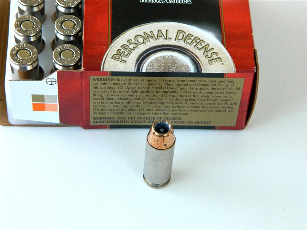 open box of Federal Hydra-Shok ammunition with one loose cartridge