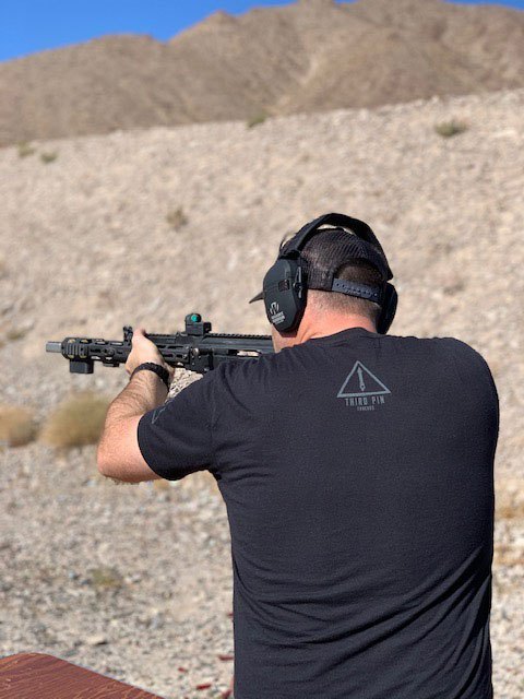 man shooting a Dissident Arms AK47 at Red Oktober in Las Vegas Nevada