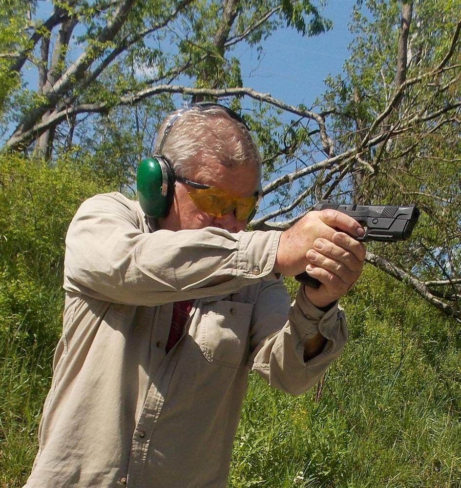 Bob Campbell quickly drawing and firing a pistol