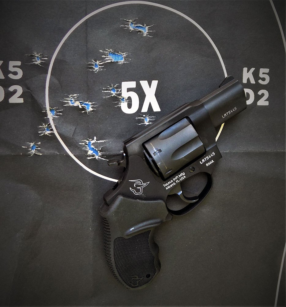 Taurus revolver on a black silhouette target