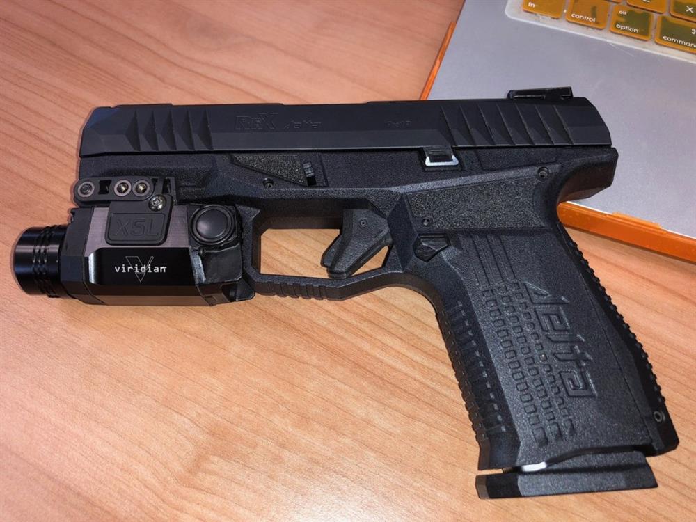Arex Rex Delta pistol with tactical light