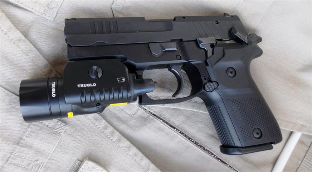 Rex Zero 9mm pistol with truglo combat light mounted