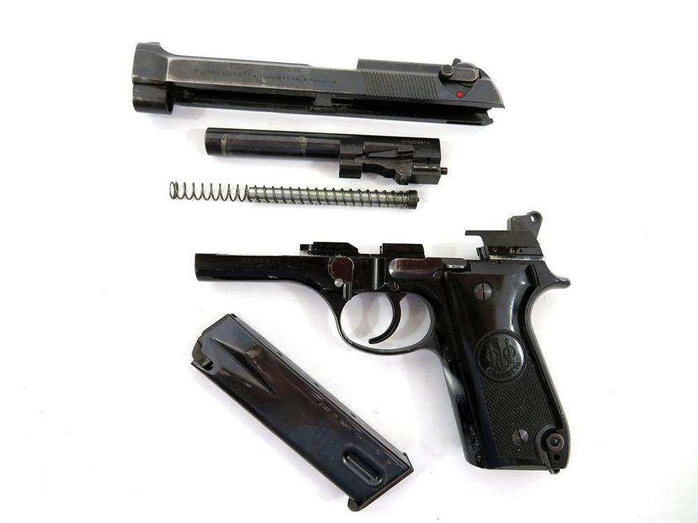 Field stripped Beretta 92S pistol left profile
